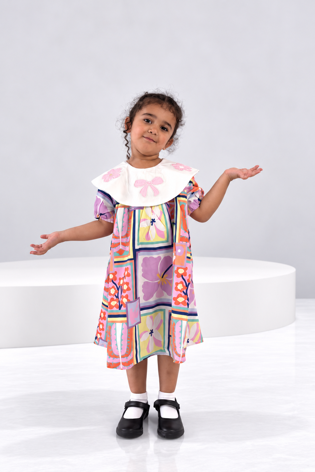 Patchwork floral girls dress with a bow appliqué collar
